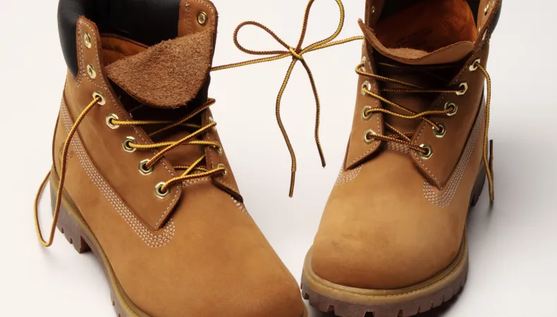 Timberland boots with the shoelaces tied together