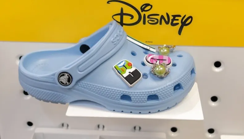 Blue Croc shoe with Disney giblets